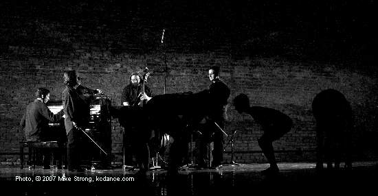 Brad Cox at piano, Jeff Harshbarger on bass - dancers hunched down in silhouette - in Fuga Tanguera by Jennifer Owen at A Modern Night at the Folly (by City in Motion) photo by Mike Strong - www.kcdance.com