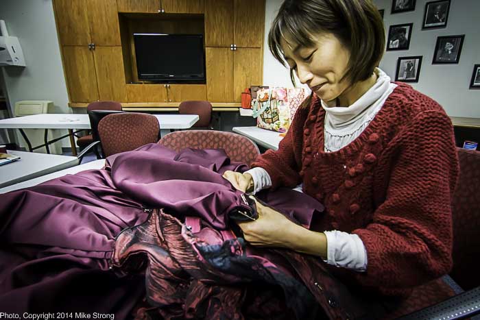 Naoko Kobayashi (Reina and Lisa's mum) In the green room working on costume repair