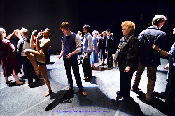 On Stage Notes for Dark Elegies with Sally Bliss from the Tudor Foundation and co-executrix of the Antony Tudor estate, working with Miyesha McGriff and Michael Tomlinson (left center). To the far left hand of head is Rose Taylor-Spann. To the right of Sally Bliss is James Jordan, Tudor repetiteur and KC Ballet ballet Master, then Paula Weber chair of the UMKC Dance Division. Just to the right of Michael is Gavin Stewart.