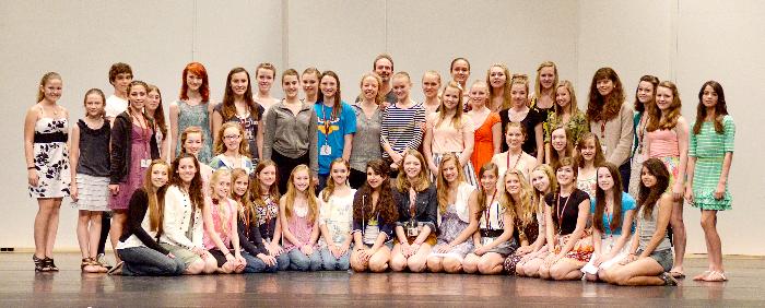A number of the Kansas City Ballet School's Summer Intensive (2011) students line up on stage in White Recital Hall for a photograph. Husband and wife dancers, Amanda McKerrow and John Gardner are in the center back. 