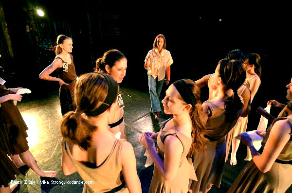 Suzanne Ryan (center, top) instructs her assembled dancers on stage during tech/dress Friday. in The Disappeareds - Choreographer: M. Suzanne Ryan - Modern Night at the Folly 2011