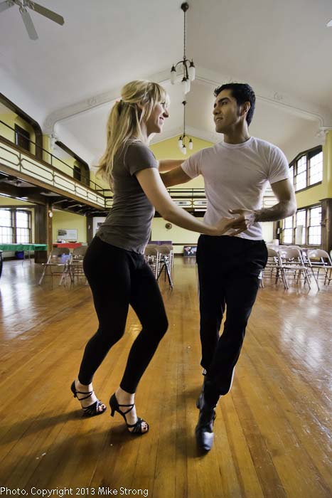 Jessica Torres and Jesus Torres of Sabor Baile rehearsing pre-performance