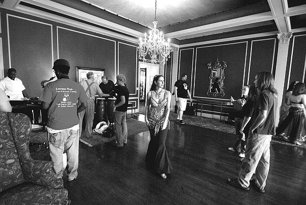 Melody Gabrielle in the middle of the room, waiting to start performing bellydance for the short film (video) - Is It Jazz? by Fred Weems